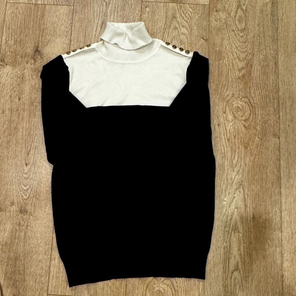 Joseph A black and white turtle neck sweater with shoulder buttons